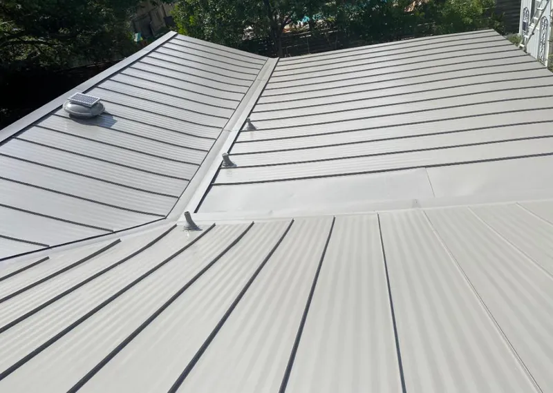 Solar attic fan installed on a metal roof for Roof Ventilation in Menlo Park